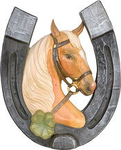 Horseshoe with horse head and four-leaf clover